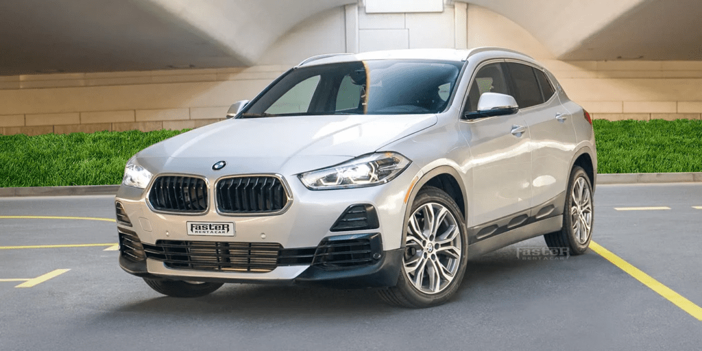 What are the benefits of renting a BMW and a Range Rover in Dubai?